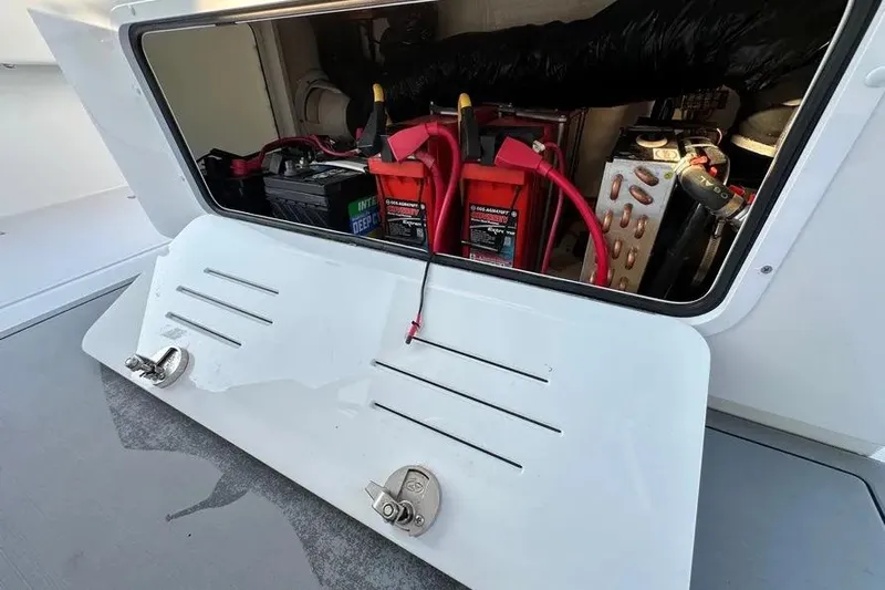  Yacht Photos Pics Battery compartment of 2022 Invincible 35 Catamaran with visible wiring and components.