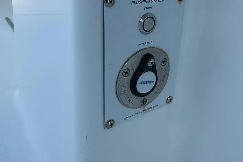  Yacht Photos Pics Flushing system panel on 2022 Invincible 35 Catamaran, featuring start button and water inlet.