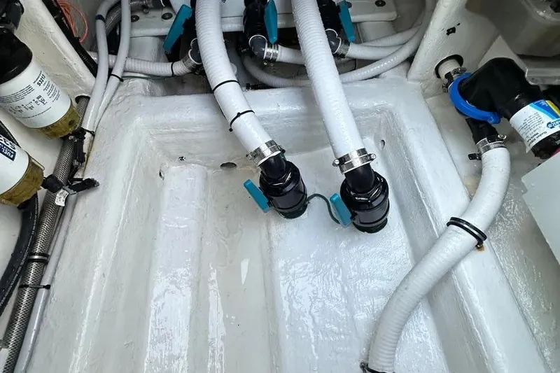  Yacht Photos Pics Engine compartment of 2022 Invincible 35 Catamaran with hoses and fittings.