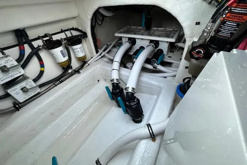  Yacht Photos Pics Engine compartment of 2022 Invincible 35 Catamaran with hoses and filters visible.