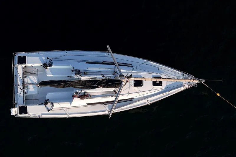 From Away Yacht Photos Pics Overhead view of 2017 Jeanneau SunFast 3200 sailboat on dark water.
