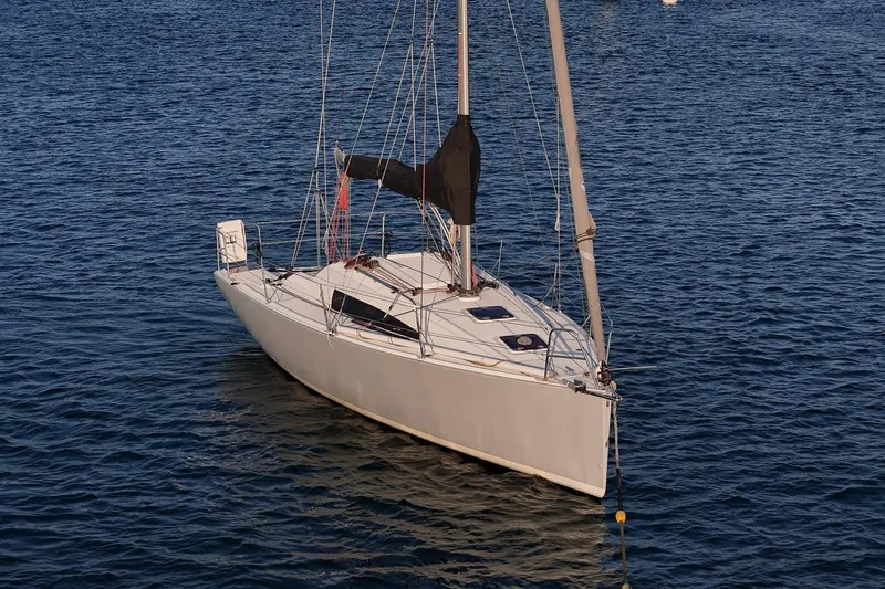 From Away Yacht Photos Pics 2017 Jeanneau SunFast 3200 sailboat on calm blue water.