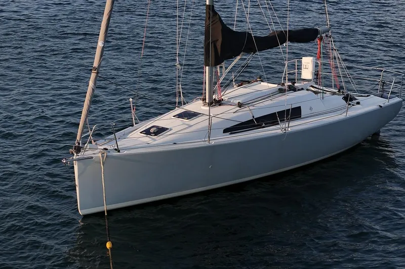 From Away Yacht Photos Pics 2017 Jeanneau SunFast 3200 sailboat on calm water, featuring sleek design and modern rigging.