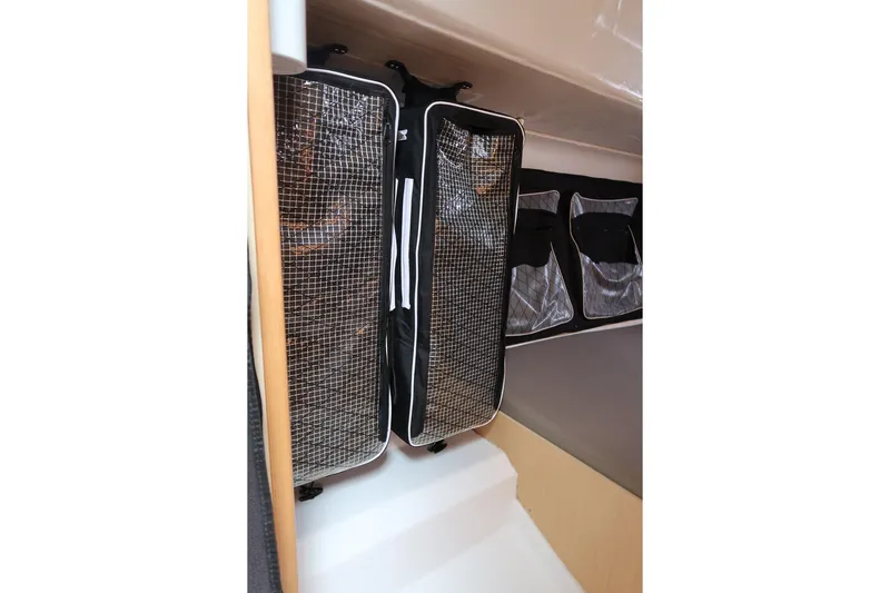 From Away Yacht Photos Pics Interior storage of 2017 Jeanneau SunFast 3200 sailboat with mesh and fabric compartments.