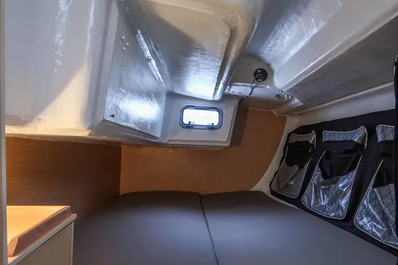 From Away Yacht Photos Pics Interior cabin of 2017 Jeanneau SunFast 3200 sailboat, featuring compact sleeping area.