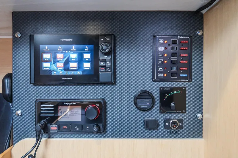 From Away Yacht Photos Pics Control panel of 2017 Jeanneau SunFast 3200 with Raymarine navigation equipment.