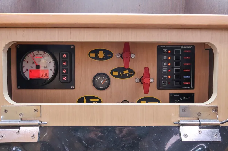 From Away Yacht Photos Pics Control panel of a 2017 Jeanneau SunFast 3200 sailboat, featuring gauges and switches.