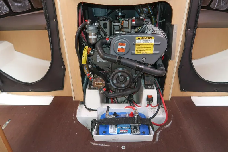 From Away Yacht Photos Pics Engine compartment of 2017 Jeanneau SunFast 3200 sailboat, featuring Yanmar engine and battery.
