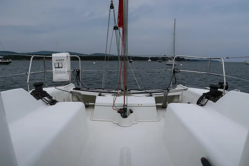 From Away Yacht Photos Pics 2017 Jeanneau SunFast 3200 sailboat cockpit with winches, ropes, and scenic water view.