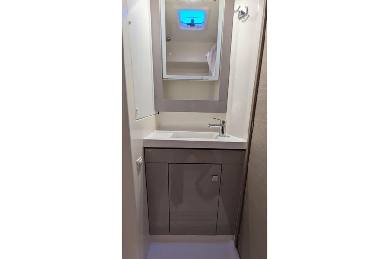 Wanderlust Yacht Photos Pics Bathroom vanity in 2020 Fountaine Pajot Saona 47 yacht, featuring modern sink and mirror.