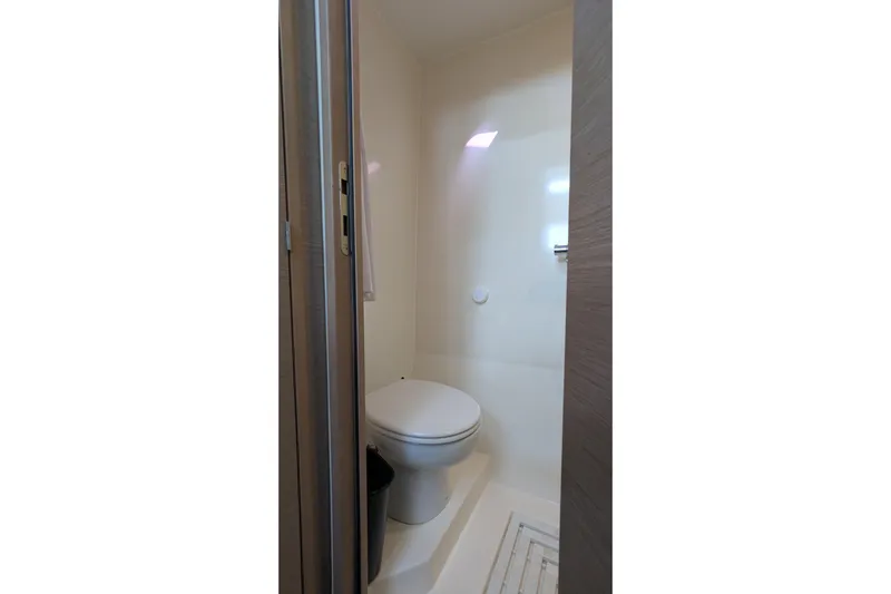 Wanderlust Yacht Photos Pics 2020 Fountaine Pajot Saona 47 yacht bathroom with modern toilet and sleek design.