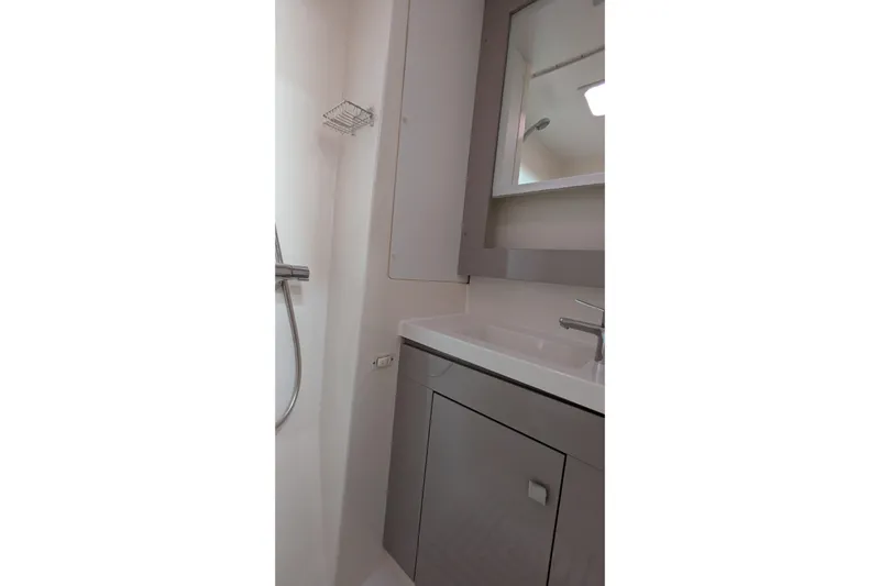 Wanderlust Yacht Photos Pics Modern bathroom interior of 2020 Fountaine Pajot Saona 47 yacht, featuring sleek fixtures.