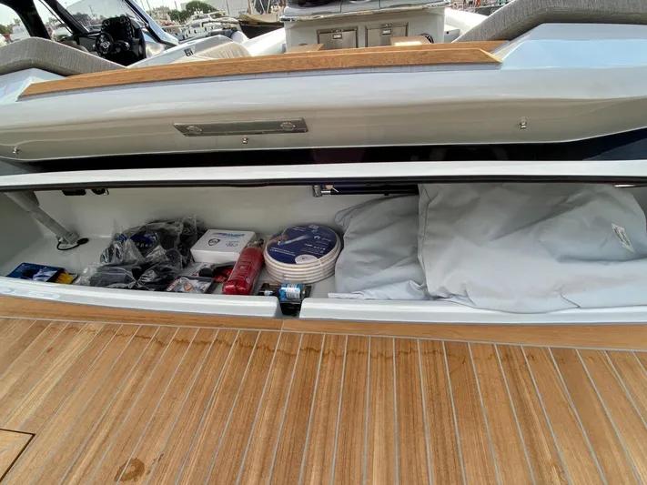 Seayou Yacht Photos Pics Storage compartment of 2022 SACS Strider 15 boat with various supplies and equipment.