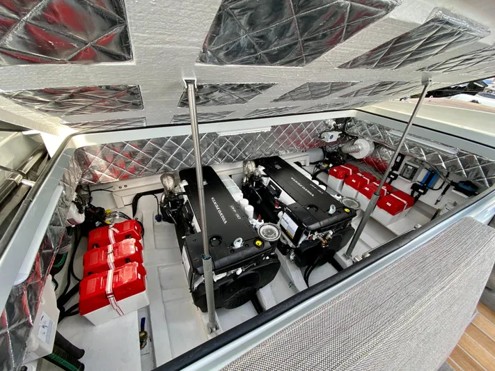 Seayou Yacht Photos Pics Engine compartment of 2022 SACS Strider 15 with dual engines and red battery boxes.