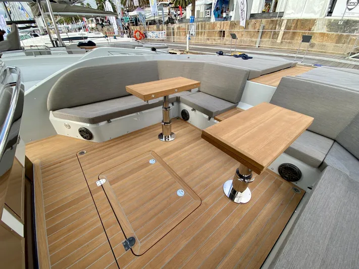 Seayou Yacht Photos Pics Luxury SACS Strider 15 yacht deck with wooden tables and seating, 2022 model.