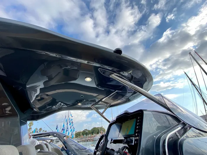 Seayou Yacht Photos Pics 2022 SACS Strider 15 boat with sleek design, under a partly cloudy sky.