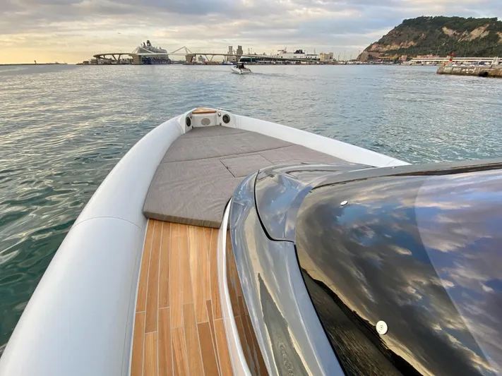 Seayou Yacht Photos Pics 2022 SACS Strider 15 luxury boat on calm waters near a scenic coastline.