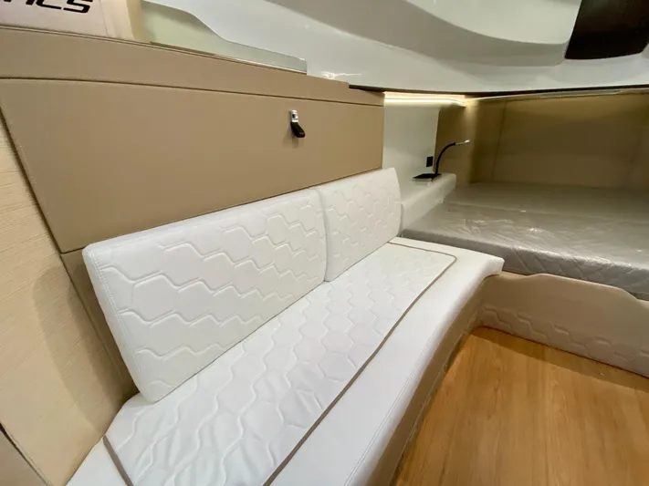 Seayou Yacht Photos Pics Interior of 2022 SACS Strider 15 yacht with white seating and modern design.