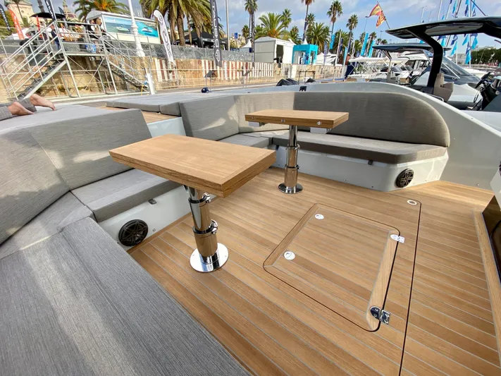 Seayou Yacht Photos Pics Luxurious 2022 SACS Strider 15 yacht interior with wooden deck and seating area.