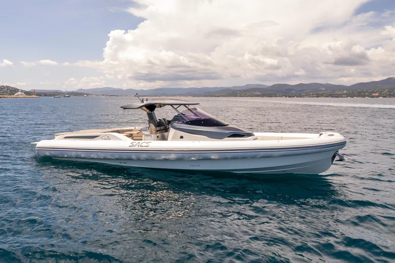 Seayou Yacht Photos Pics 2022 SACS Strider 15 boat cruising on open water under a cloudy sky.