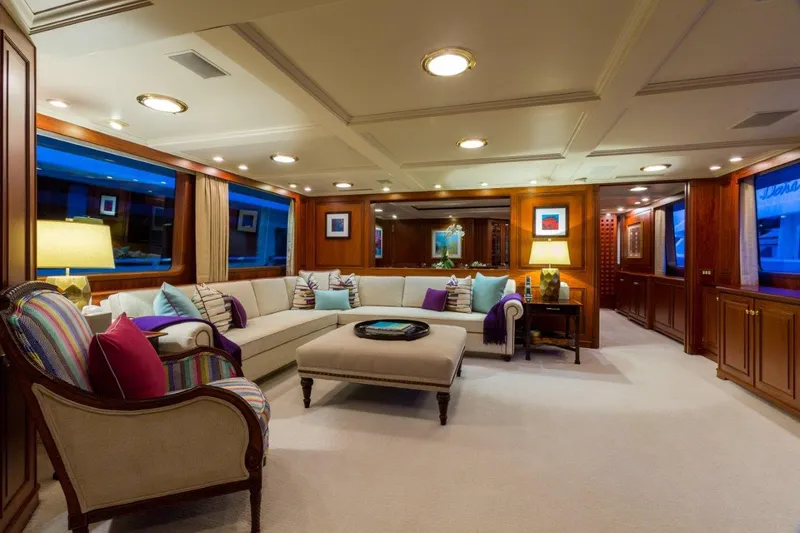 Lady J Yacht Photos Pics Luxurious interior of a 1997 Palmer Johnson motor yacht with elegant seating and ambient lighting.