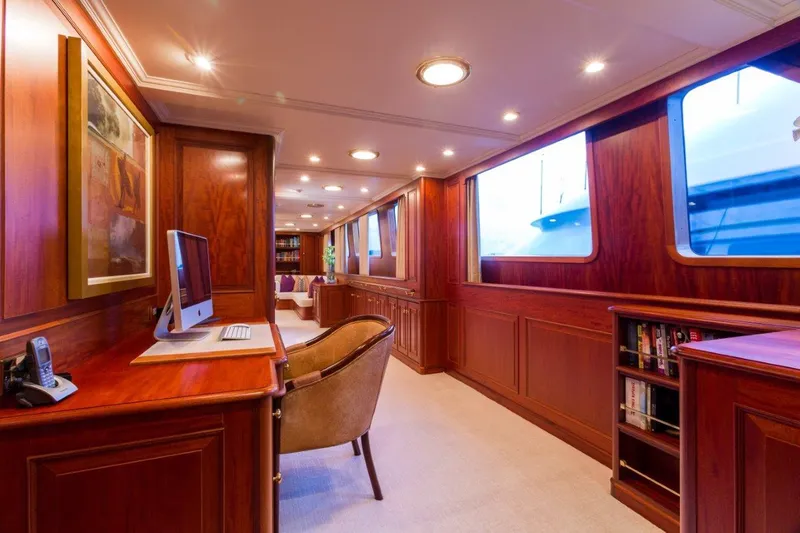 Lady J Yacht Photos Pics Luxurious interior of 1997 Palmer Johnson motor yacht with wood paneling and modern amenities.