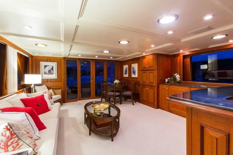 Lady J Yacht Photos Pics Luxurious 1997 Palmer Johnson motor yacht interior with elegant wood paneling and modern furnishings.