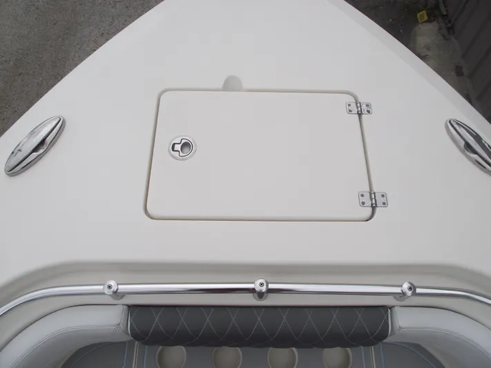  Yacht Photos Pics 2021 Cobia 301 Center Console boat deck with storage hatch and stainless steel fittings.
