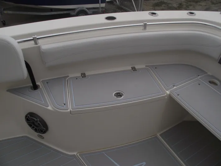  Yacht Photos Pics 2021 Cobia 301 Center Console boat interior with seating and storage compartments.