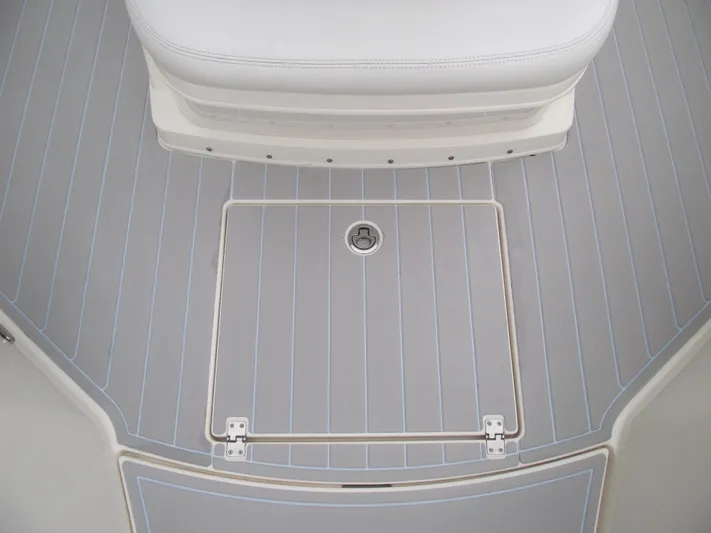  Yacht Photos Pics 2021 Cobia 301 Center Console boat deck with storage hatch and seating.