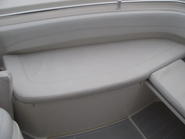  Yacht Photos Pics 2021 Cobia 301 Center Console boat interior with cushioned seating and sleek design.