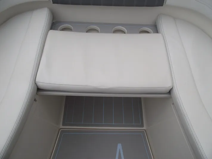  Yacht Photos Pics 2021 Cobia 301 Center Console boat interior with cushioned seating and cup holders.