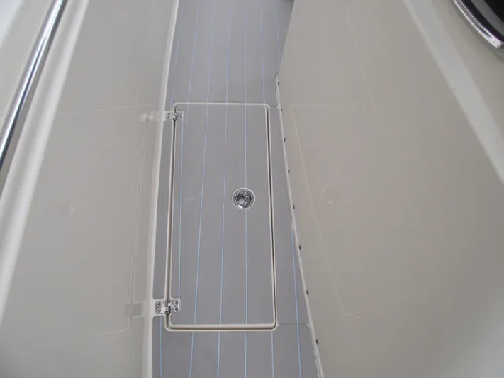  Yacht Photos Pics 2021 Cobia 301 Center Console boat deck with storage hatch.