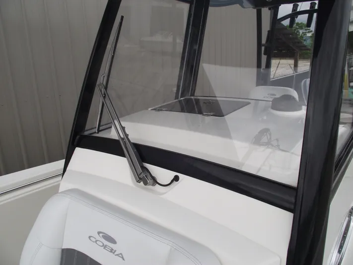  Yacht Photos Pics 2021 Cobia 301 Center Console boat with windshield and seating detail.