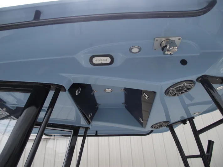  Yacht Photos Pics 2021 Cobia 301 Center Console boat's overhead view with speakers and storage compartments.