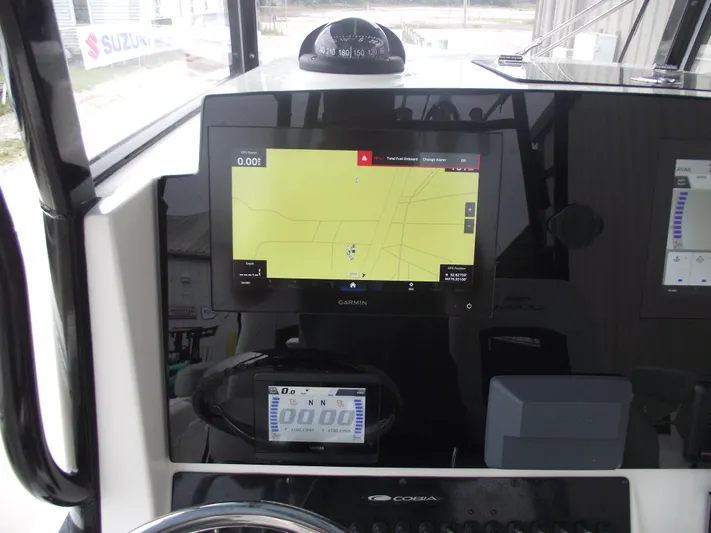  Yacht Photos Pics 2021 Cobia 301 Center Console dashboard with Garmin navigation display.