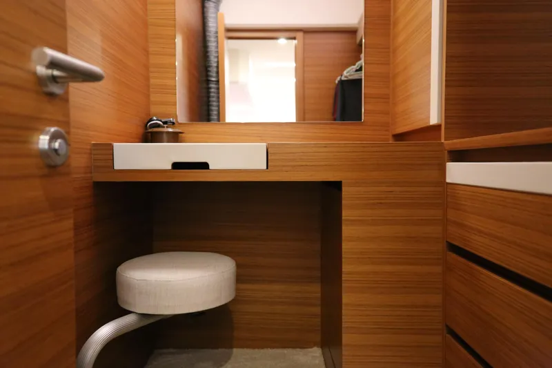  Yacht Photos Pics Modern wooden interior of 2023 Greenline 45 Coupe yacht cabin with seating and storage.