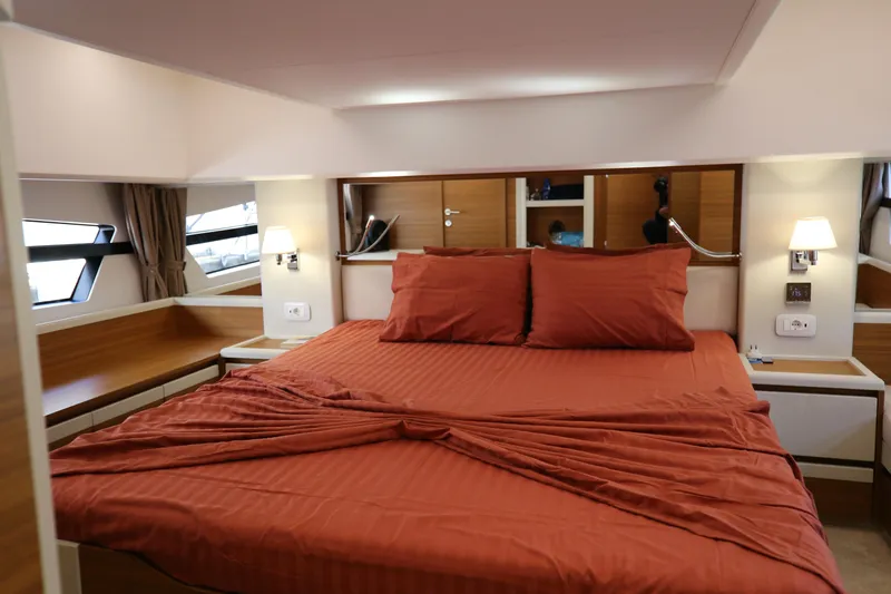  Yacht Photos Pics Luxurious bedroom interior of 2023 Greenline 45 Coupe yacht with elegant red bedding.