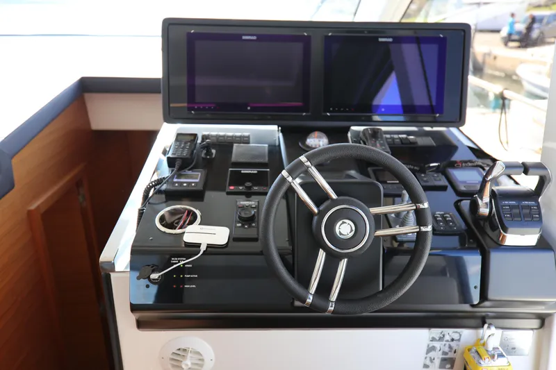  Yacht Photos Pics Helm station of 2023 Greenline 45 Coupe with dual screens and modern controls.