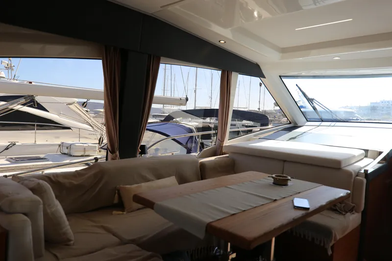 Yacht Photos Pics Interior of 2023 Greenline 45 Coupe yacht with elegant seating and marina view.