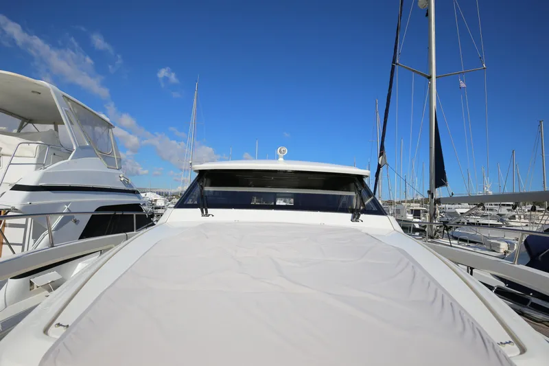  Yacht Photos Pics 2023 Greenline 45 Coupe yacht docked at marina under clear blue sky.