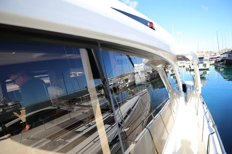  Yacht Photos Pics 2023 Greenline 45 Coupe yacht docked at a marina, reflecting clear blue skies.