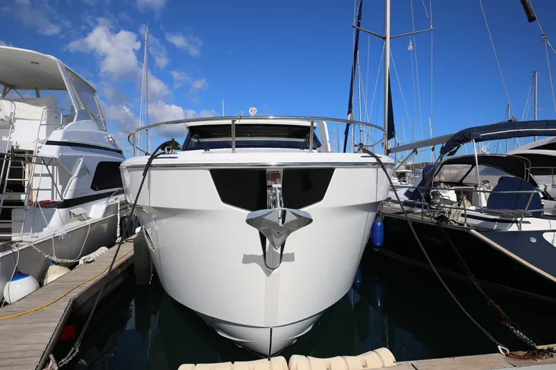  Yacht Photos Pics 2023 Greenline 45 Coupe yacht docked at marina under clear blue sky.