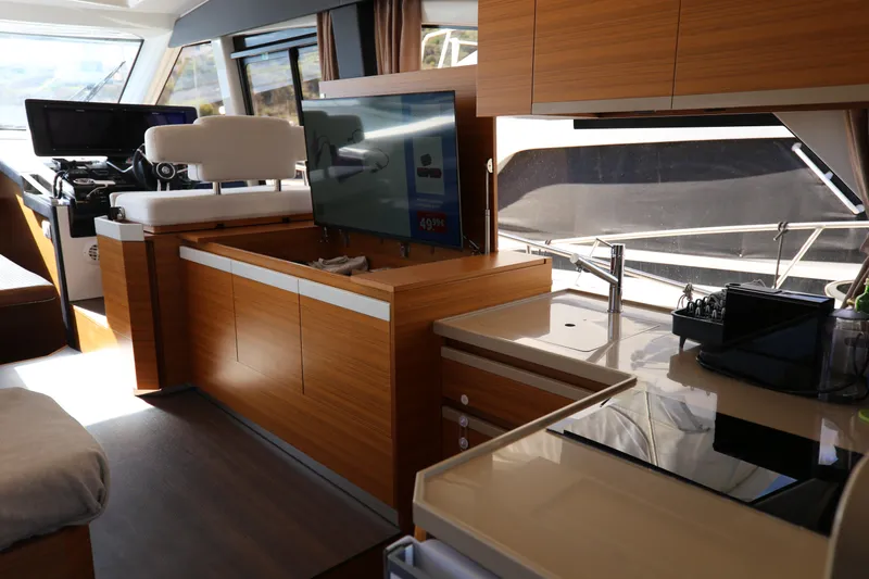  Yacht Photos Pics Interior of 2023 Greenline 45 Coupe yacht with modern kitchen and seating area.