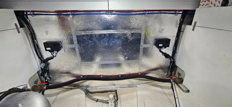  Yacht Photos Pics Engine compartment of 2023 Greenline 45 Coupe with insulation and wiring visible.