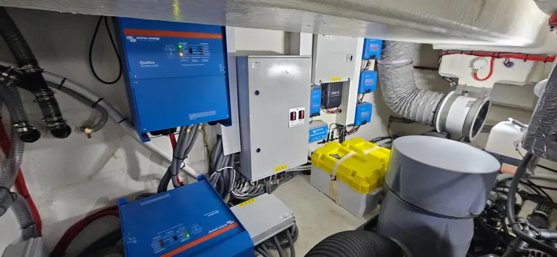  Yacht Photos Pics Electrical system inside 2023 Greenline 45 Coupe yacht, featuring blue control units and wiring.