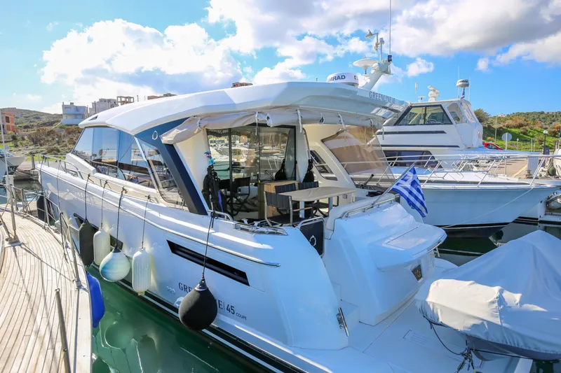  Yacht Photos Pics 2023 Greenline 45 Coupe yacht docked, featuring sleek design and modern amenities.