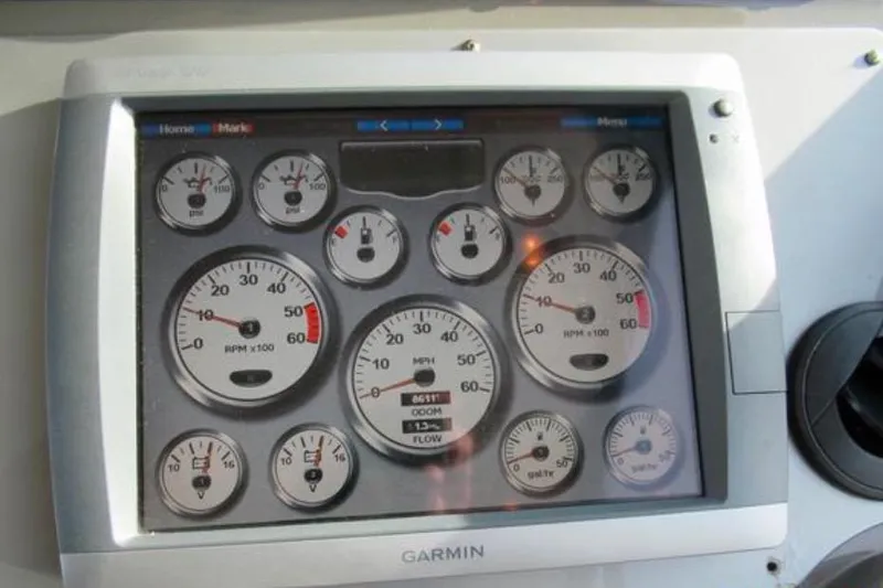  Yacht Photos Pics Garmin display with gauges on 2012 Regal 42 Sport Coupe dashboard.