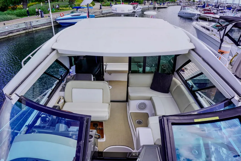  Yacht Photos Pics 2012 Regal 42 Sport Coupe yacht interior with spacious seating at a marina.