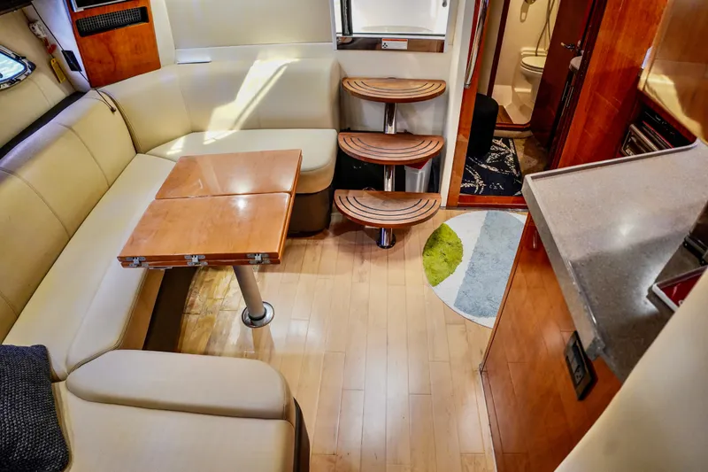  Yacht Photos Pics Luxurious interior of a 2012 Regal 42 Sport Coupe yacht with elegant seating and wooden accents.